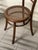 A unique set of 11 late 19th-century beechwood chairs with round wicker seats, "Vienna" style. The set has only had a...