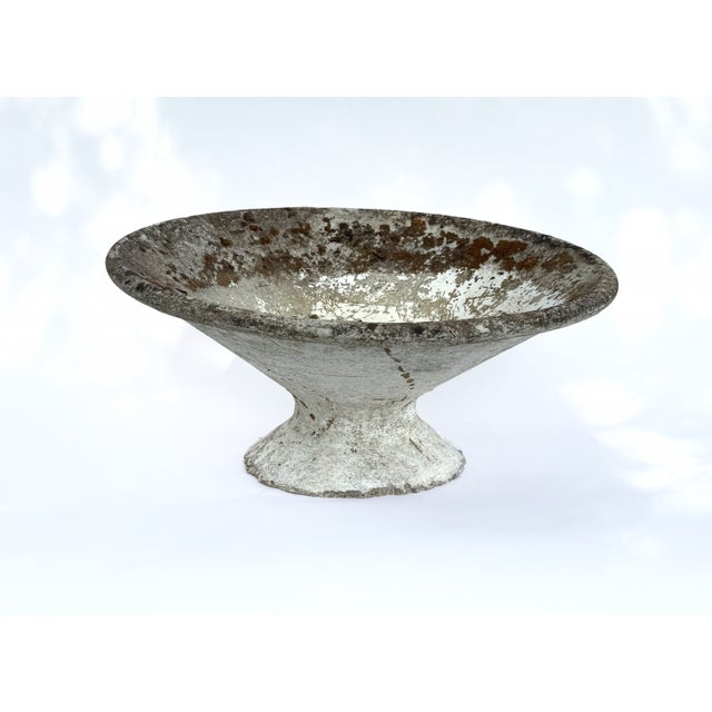 An iconic “Off-Kilter” planter designed by Willy Guhl executed in molded fiber cement with the sculptural asymmetry that...