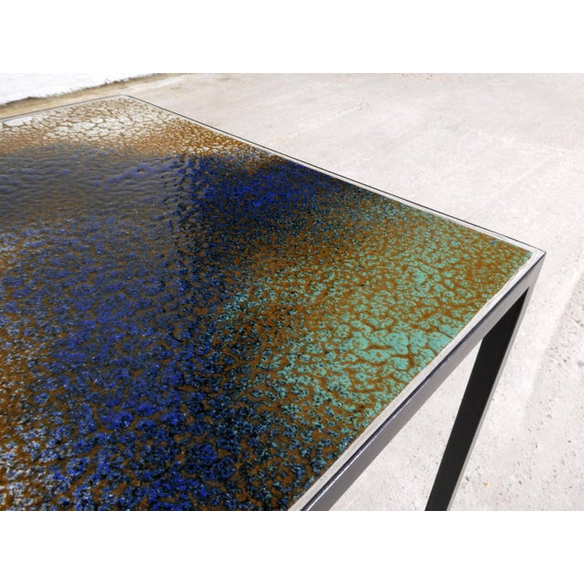 The tabletops date from the 1970s; the metal bases were recently custom-made.