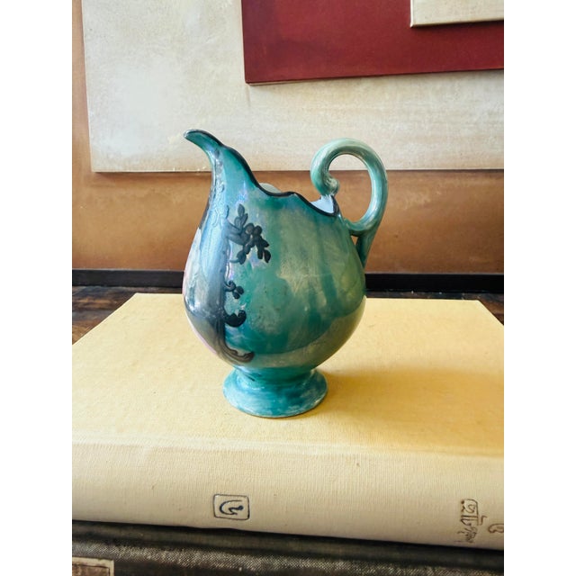 A beautiful little antique Limoges porcelain creamer or miniature pitcher featuring a finely painted portrait in the...