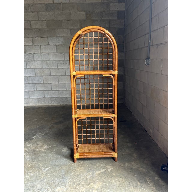 Gorgeous bamboo framed shelf with cane shelves and cane wrapped corners. Nice details and a great size. Could be used in a...