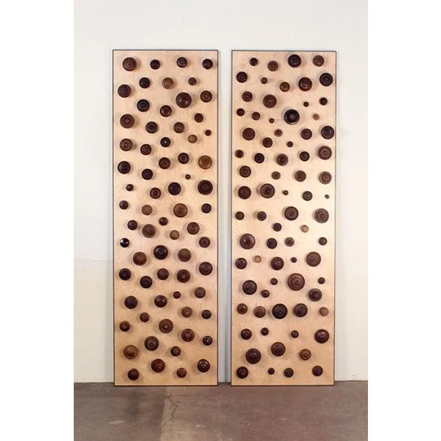 'Boucliers', a pair of decorative turned wood panels by Eric Thévenot. Unique piece, signed and dated 2012. Patinated...