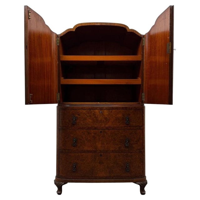 A superb and exceptionally well-crafted early 20th-century English Edwardian cupboard, distinguished by its magnificent...