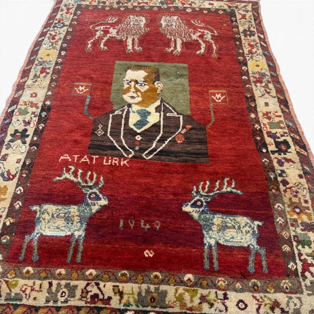 An exceptional and highly collectible vintage Turkish rug from Sivas, dated 1949, featuring a rare and symbolic figural...