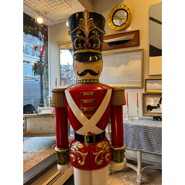 This is a decorative life sized nutcracker. It has fabulous details and stands on a drum pedestal. It has a stunning hat...