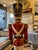 This is a decorative life sized nutcracker. It has fabulous details and stands on a drum pedestal. It has a stunning hat...