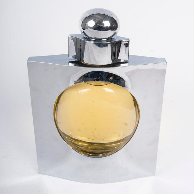 Giant promotional bottle by azzaro, 20th century. Giant promotional bottle by azzaro made of silver-colored acrylic glass...