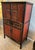 This exquisite late Qing Dynasty red lacquer wood wedding cabinet from the late 1800s features beautifully hand carved...