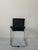 The D20 chair with armrests was designed by Jean Prouve and manufactured by TECTA. Its specially bent tubular frame and...
