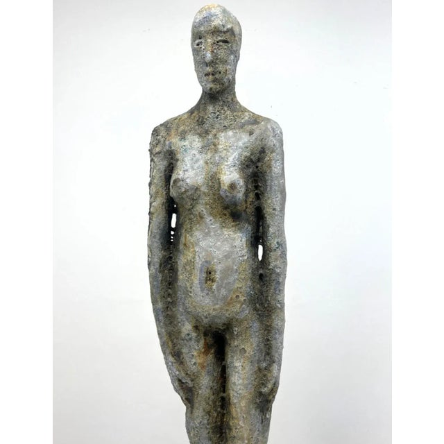 90" Tall Pottery Figural Statue Sculpture. Slender Nude Form. Supported by concrete base with iron stand. Dimensions:...