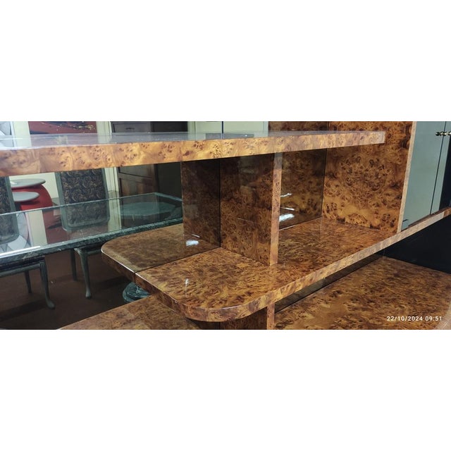 Living room furniture in walnut root veneer with sides and details in glossy black lacquer, 5 doors, one of which has 3...