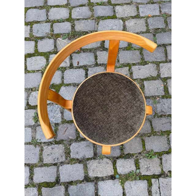 This armchair from the 8000 series is a classic of Danish furniture design, created by the duo Rud Thygesen & Johnny...