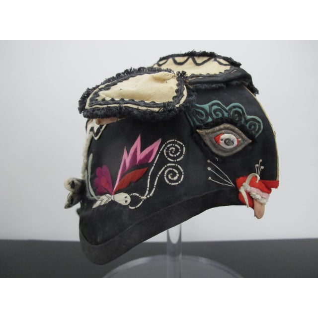 Chinese children's tiger hat, likely from the late 19th or early 20th century. These hats were traditionally worn by...