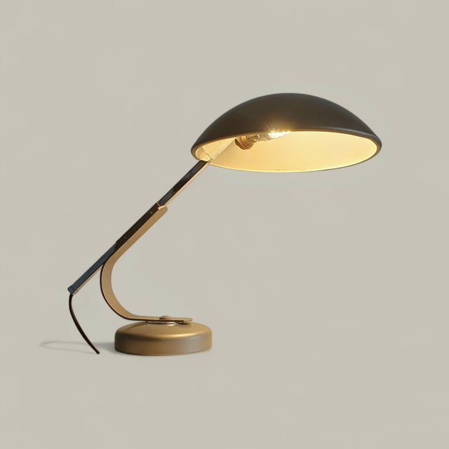 This elegant desk lamp by ferdinand solere perfectly illustrates french modernist design from the 1950s to the 1970s. made...