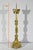 This fully chased gilded bronze candlestick features a chalice decorated with a crown and leaves. The six-sided shaft,...