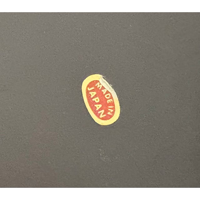 1960s hollywood regency asian-style black lacquered nesting trays w/ gold corner detail; set of 2. Made in Japan....