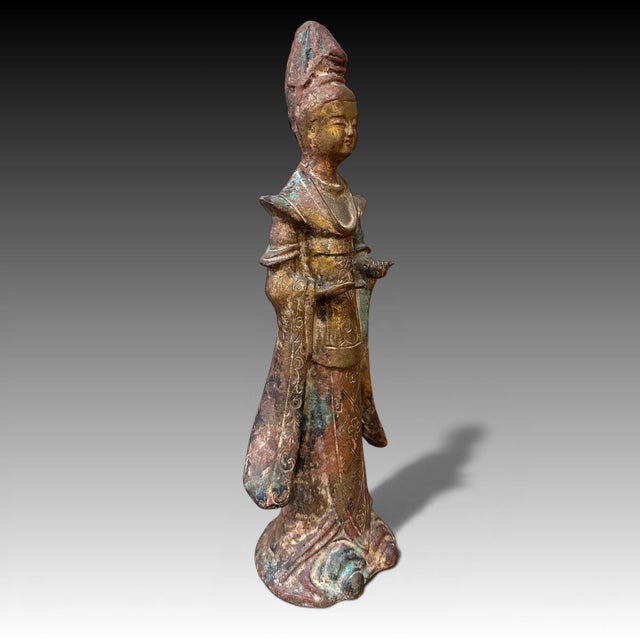 An antique Chinese gilt bronze figure that appears to be either Daoist or a guanyin form. The age is unknown, however, it...