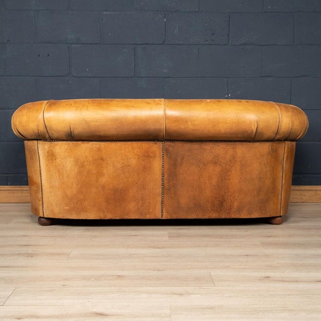 Showing superb patina and colour, this wonderful sofa was hand upholstered in sheepskin leather in Holland by the finest...