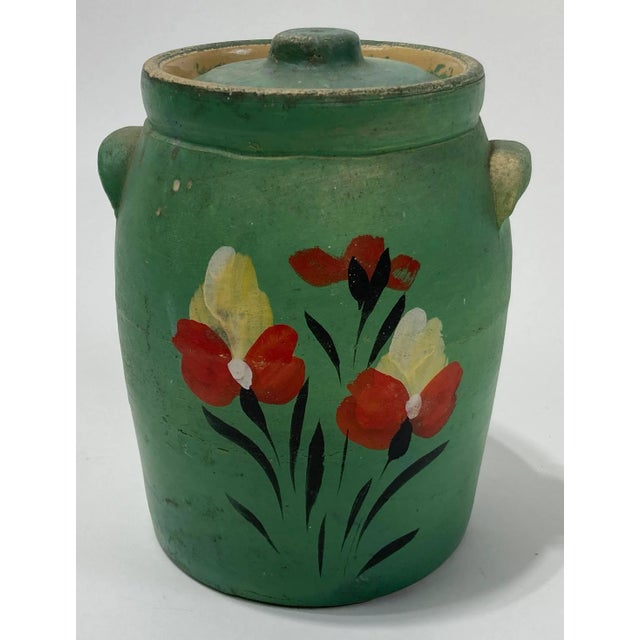 Antique farmhouse style lidded crock glazed in bright green. Features vibrant hand-painted floral motif. Marked USA on...