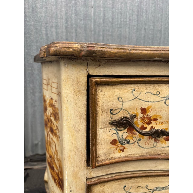 Gorgeous Italian Venetian painted 2 drawer commode in off white with goldish painting accented with blue. This piece is...