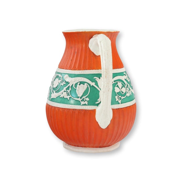 Mid 19th century English salt glaze water pitcher by Ashworth Brothers Potteries, featuring unusually vibrant orange and...