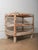 This Indian wooden shelving table features a strong, utilitarian form highlighted by its beautifully aged, original...