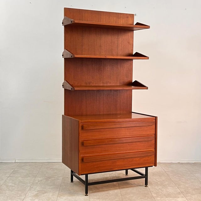 Elegant and minimalist, this single-column bookcase is a splendid testament to 1960s Midcentury Modern design. Featuring...