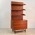 Elegant and minimalist, this single-column bookcase is a splendid testament to 1960s Midcentury Modern design. Featuring...