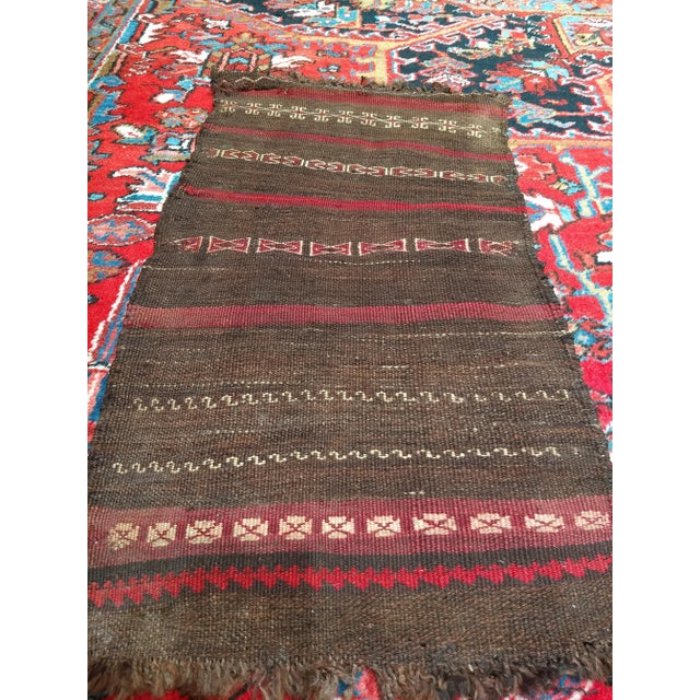 This is an antique Persian Baluch kilim from the early 20th century. Dimensions: 1’ 6” x 3’ Place of Origin: Persia...