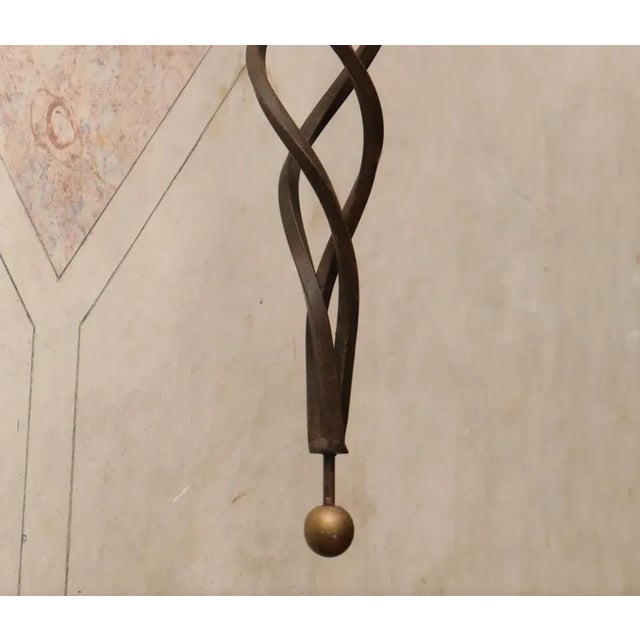 Pair of Italian appliqués. Painted iron structure. Frosted glass globes. Beginning 20th century. Dim. - 90 cm. This piece...