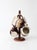 Set of four 1970s handmade studio pottery mugs with a turned wooden stand. Finished in warm cream, brown, and ochre...