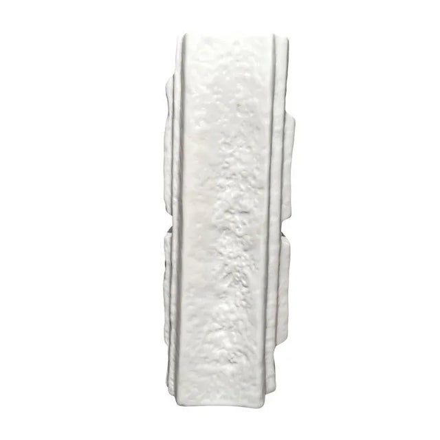 A textured vase in white bisque porcelain. Martin Freyer was an architect, graphic designer (he created the Volkswagen VW...