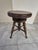This is an antique Victorian-style adjustable swivel piano stool, typically dating from the late 19th century to early...