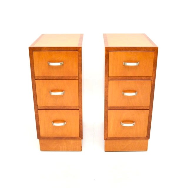 A sleek and stylish pair of Art Deco satinwood and walnut bedside chests. They were made in England, they date from the...