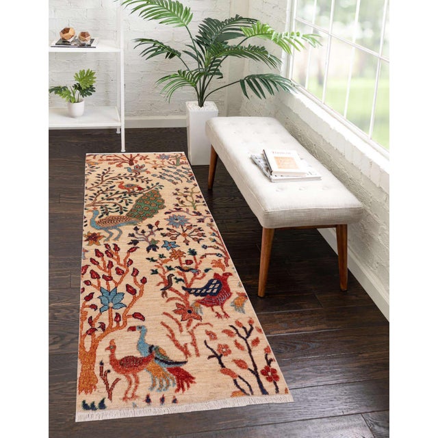 Enhance the ambiance of your home with this magnificent Persian-influenced Turkish hand-knotted rug made by skilled...