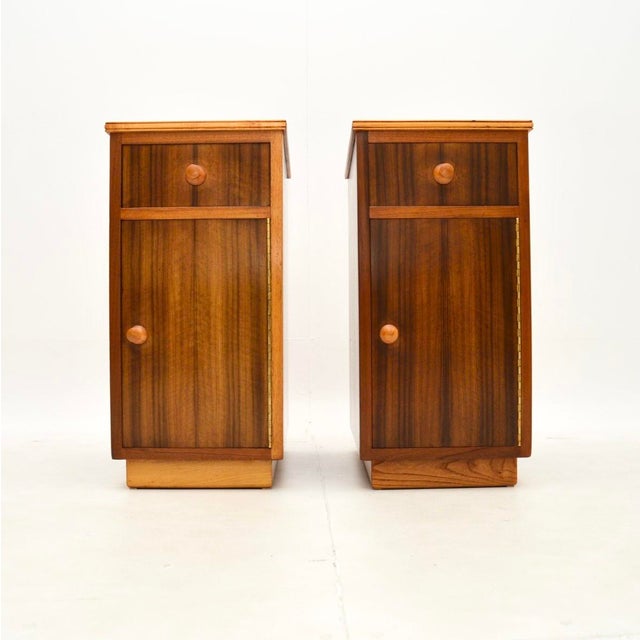 A smart and very stylish pair of vintage walnut bedside cabinets by Neil Morris. They were made in England, they date from...