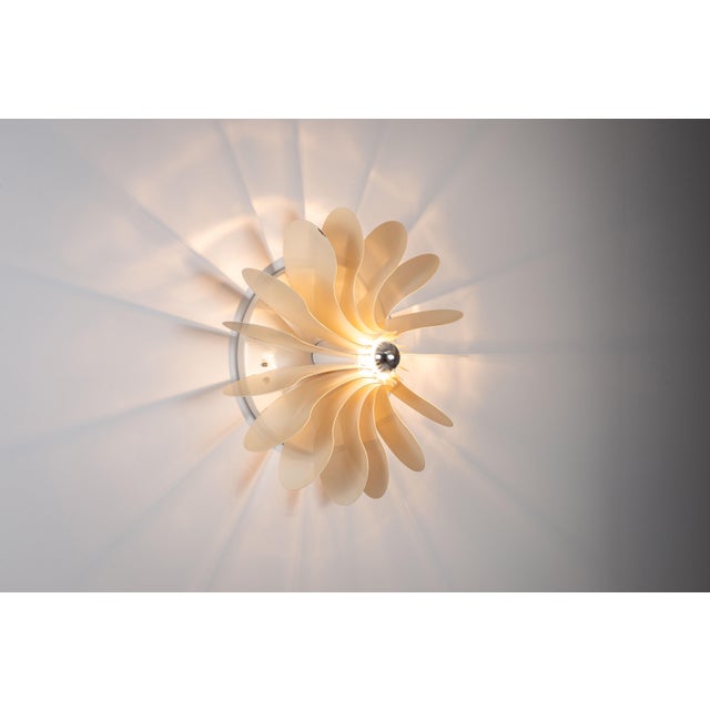 The ‘Bolide’ wall or ceiling lamp, designed by Hermian Sneyders de Vogel for Raak Amsterdam in the late 1960s/early 1970s,...