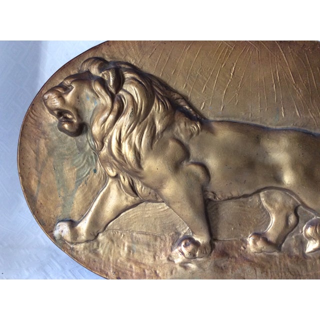 An Antique cast metal Plaque of a Lion. The Plaque is made from a non magnetic metal and is big at 21" wide x 15" high x 1...
