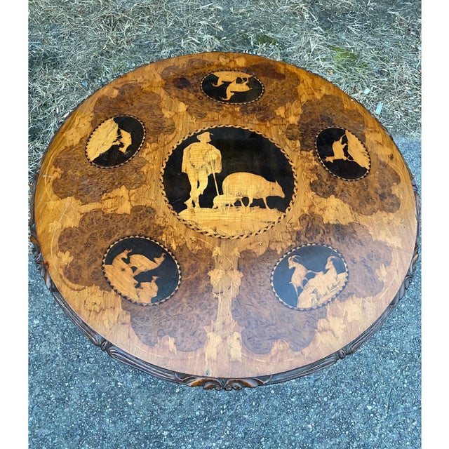 Great sized late 19th-early 20th century black forest carved and inlaid table with scenes of stags.