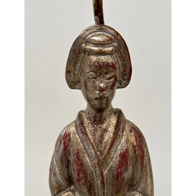 Glamorous sculptural table lamp in the style of James Mont featuring a silver leaf Asian female figure, beautiful front...