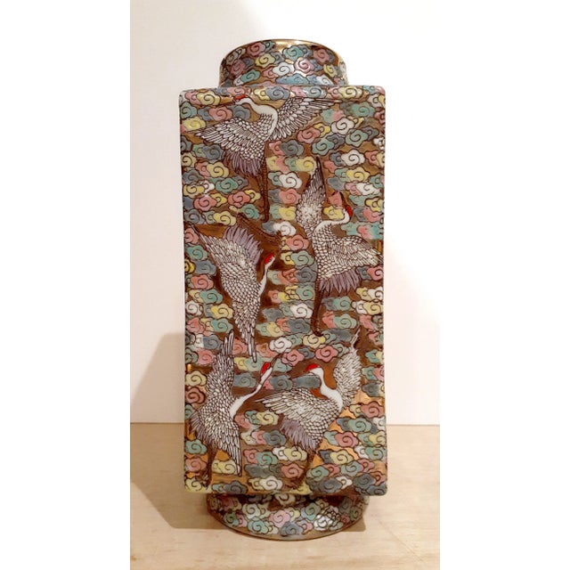 Chinese porcelain dancing cranes cong , A finely formed, square vase with a circular top and bottom, decorated with a...