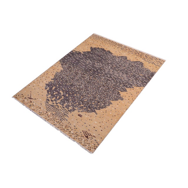 Elevate your interior with this hand-knotted high-low wool area rug, designed to bring depth and dimension to any room....