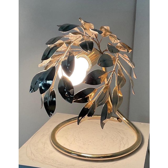 Magnificent lamp with Tone base and top structure in painted aluminum and represented in the form of laurel leaves....