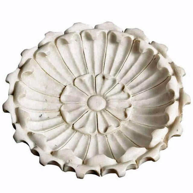 A delicately hand carved, large shallow bowl with a floral motif. From India. White marble with fine veining, circa 1960....