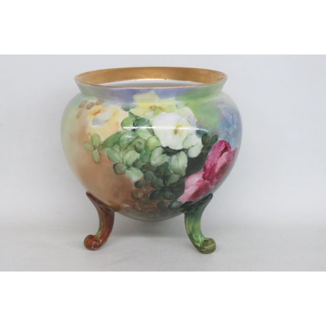 This wonderful Footed Jardiniere is made out of porcelain / ceramic. This beautiful bowl presents a classically vintage...