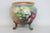 This wonderful Footed Jardiniere is made out of porcelain / ceramic. This beautiful bowl presents a classically vintage...