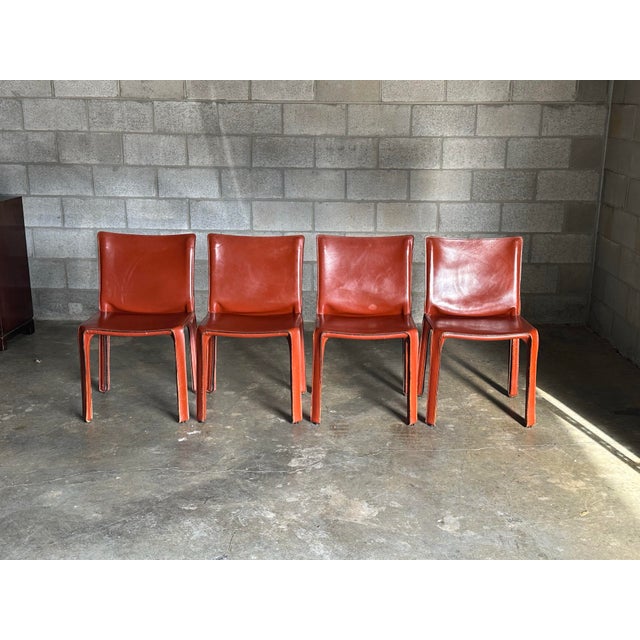 Iconic chairs designed by Mario Bellini for Cassina. Features a steel frame wrapped in thick leather and complete with a...