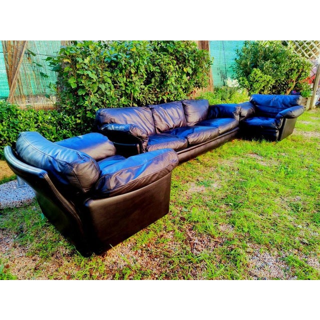 Living room complete Poltrona Frau, model "Poppy", designed by Tito Agnoli in 1974 Composed of a three seats sofa and a...