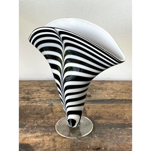 This stunning art glass vase is a masterclass in modernist design, drawing significant inspiration from the celebrated...