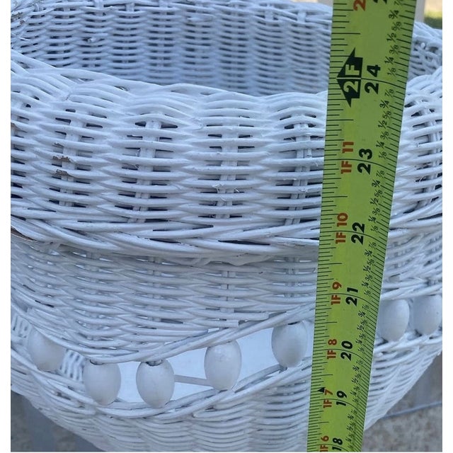Add timeless coastal charm to your home with this **Vintage Mid-Century Modern White Wicker Rattan Floor Planter**....